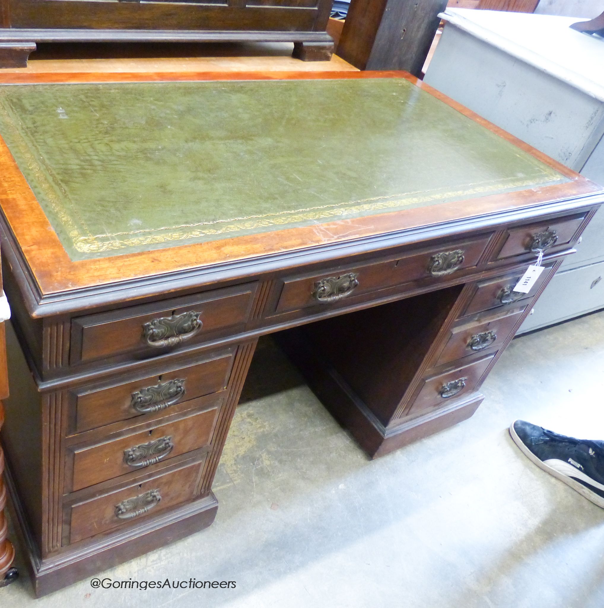 An Edwardian walnut pedestal desk. W-122, D-68, H-74cm.
